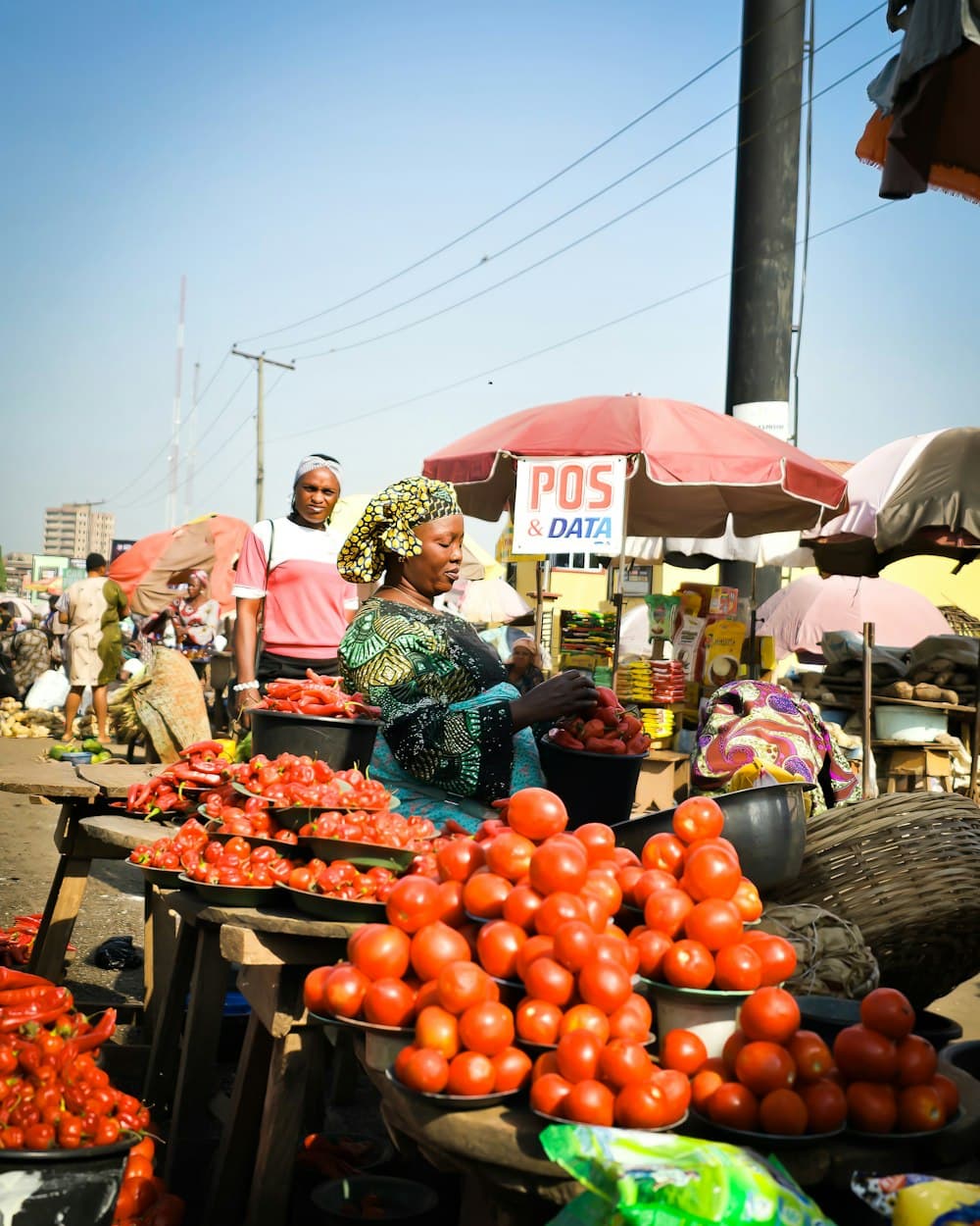 Market trader arranging fresh produce for sale